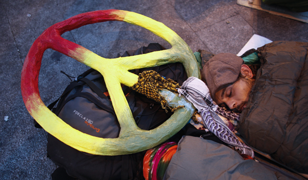 Demonstrators camp out in Madrid's Puerta del Sol during eighth day of protests